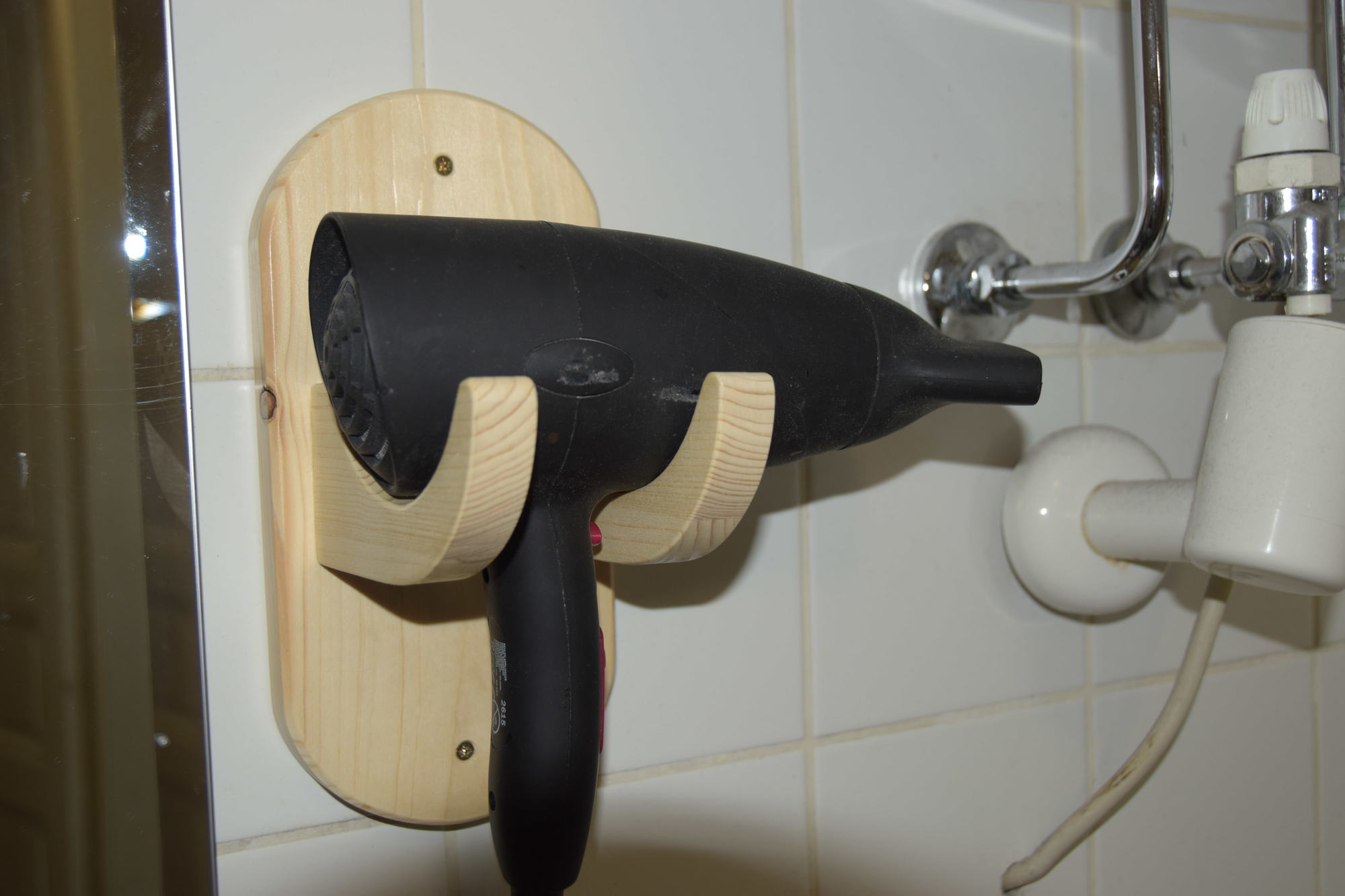 Holder for the hairdryer